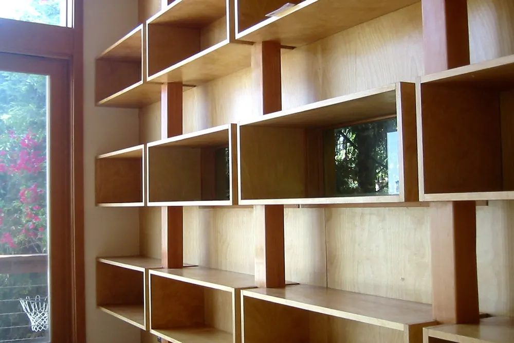 A wall of open timber storage boxes and shelving of the kind built for garages and utility spaces in San Clemente CA