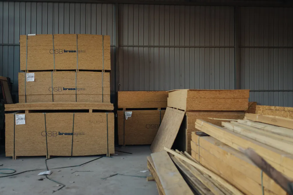 Stacked sheet goods and lumber in a storage area, the raw material for cabinet boxes built for San Clemente CA homes